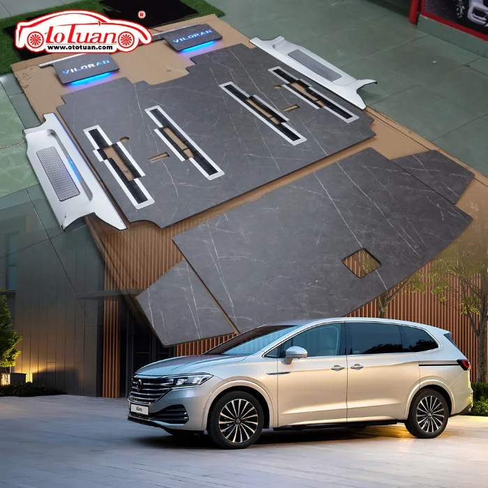 Bộ sàn vân đá màu xám cho Volkswagen Viloran với các khe ray ghế và chi tiết ốp đi kèm.